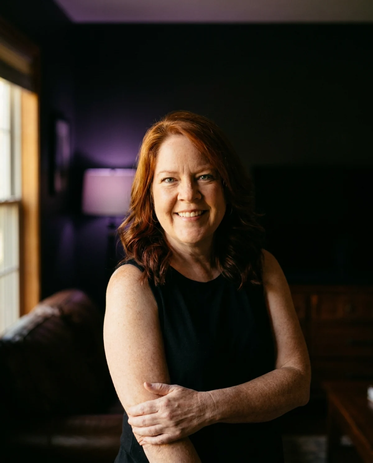 Michelle Anderson smiling in a warmly lit room